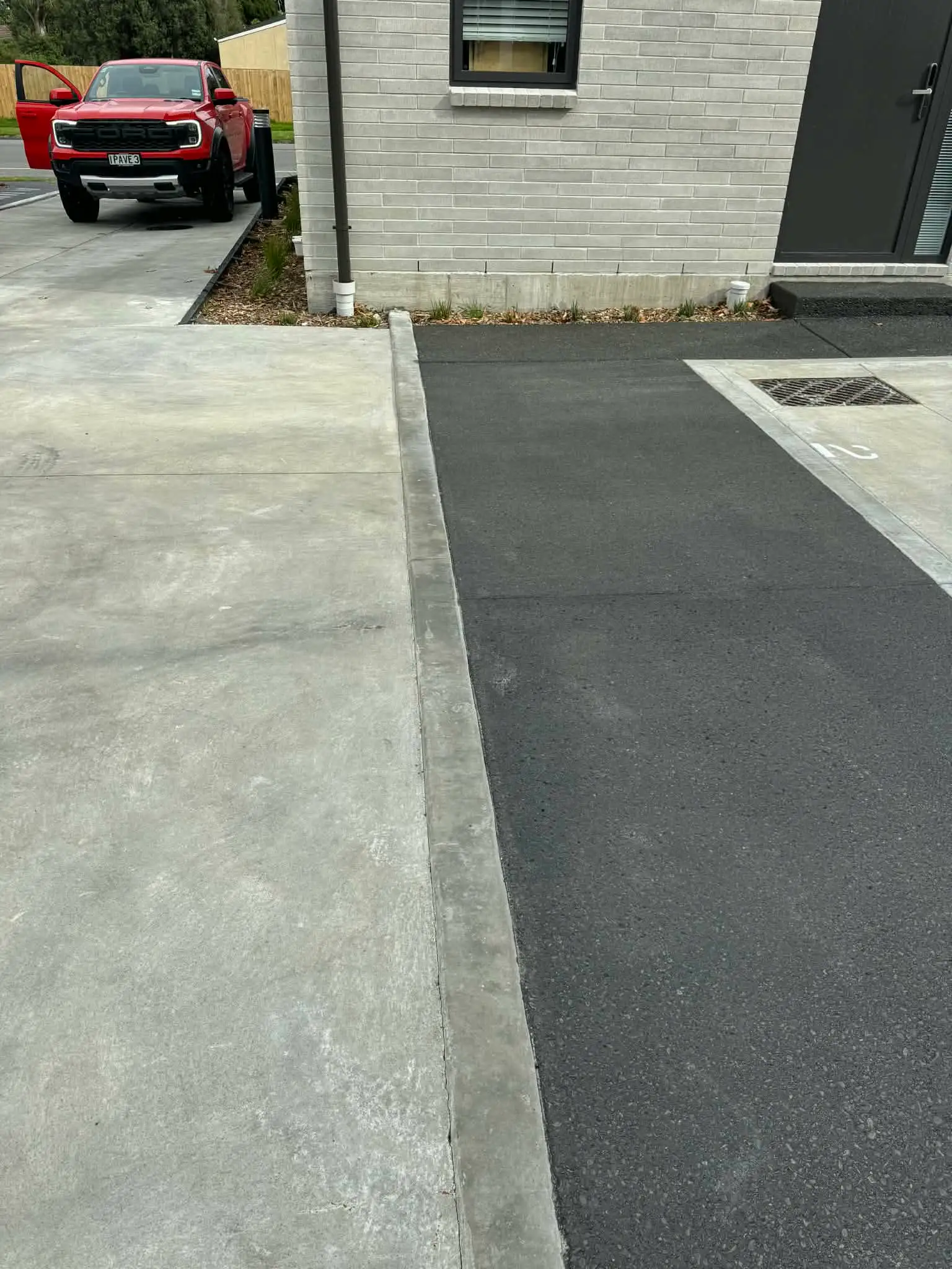 Channel drain installed in a concrete driveway in Christchurch